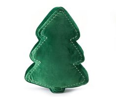 a small green christmas tree sitting on top of a table