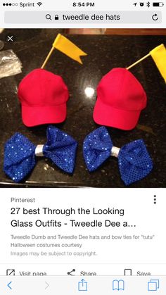 two red and blue bow ties on top of a black table next to a baseball cap