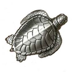 a metal sea turtle on a white background