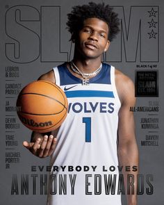 a man holding a basketball on top of a magazine cover with gold lettering and an image of the player