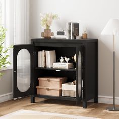 a black bookcase with books and other items on it