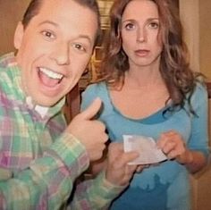 the man and woman are posing together for a photo while holding their thumbs up in front of them