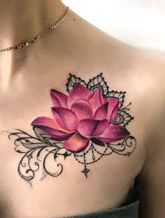 a woman with a pink flower tattoo on her chest