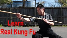 a man holding a baseball bat with the words learn real kunng fu