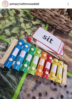 an assortment of colorful wooden toys sitting on top of a table