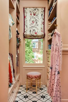 the closet is filled with clothes and other items, including a bench in front of an open window