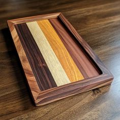 a wooden cutting board sitting on top of a table