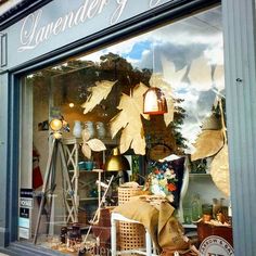 a store front window filled with lots of items