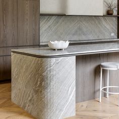 a white bowl sitting on top of a counter in a kitchen next to a bar