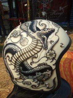 the helmet is decorated with intricate designs