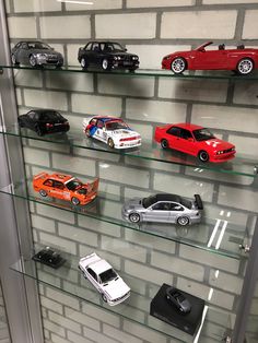 a display case filled with different types of toy cars