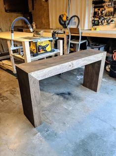 a workbench in a garage with tools on it