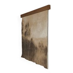 a brown and white painting hanging on the wall