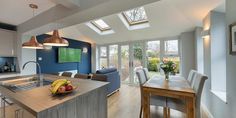 a kitchen with an island and skylights in it's center area is shown