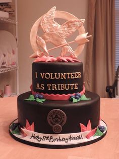 a birthday cake decorated with an image of a bird and the words volunteer as tribute