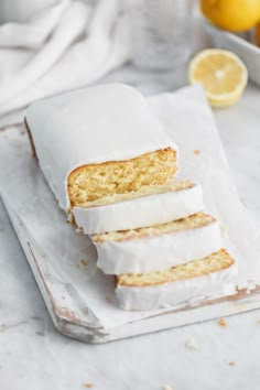 slices of lemon cake sitting on top of a cutting board