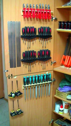 there are many tools hanging on the wall