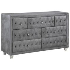 a large gray dresser with many drawers and knobs on the front, side view