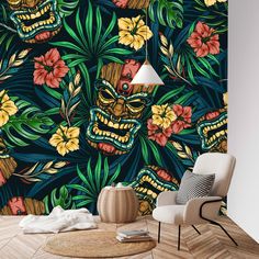 a living room with a wallpaper that has an image of tiki and flowers on it