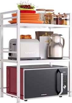 a microwave oven sitting on top of a shelf next to a toaster and coffee pot