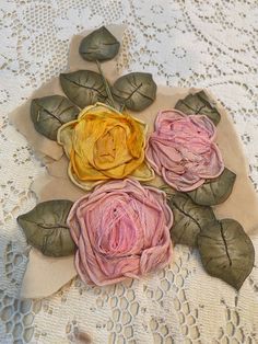 some flowers are sitting on top of a doily