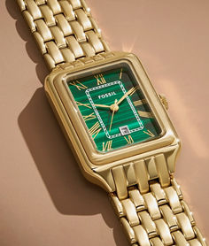 The rectangular Raquel watch is a new classic, updated for the current moment. Slim and versatile, this one-of-a-kind timepiece features a genuine malachite stone dial, three-hand date movement and a brushed and polished gold-tone 7-link bracelet.

Engravable watches. Embossable leather goods. Handpicked jewelry. It’s your destination for those “more than just a gift” gifts—just in time for Mother’s Day. Green Watches With Rectangular Dial And Analog Display, Modern Green Watch With Rectangular Dial, Modern Green Watch Accessories With Rectangular Dial, Green Formal Watch With Date Display, Formal Green Watch With Date Display, Timeless Green Watch With Date Display, Timeless Green Watch Accessories With Date Display, Green Timeless Watch Accessories With Date Display, Green Rectangular Watches For Formal Occasions