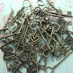 an assortment of antique keys are displayed on a table