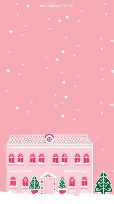 a pink house with christmas trees on the front and snow on the ground in front