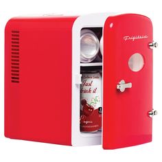 a red mini fridge with the door open to reveal an apple drink in it's compartment