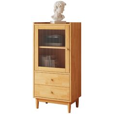 a wooden cabinet with a bust on top and drawers below it, against a white background