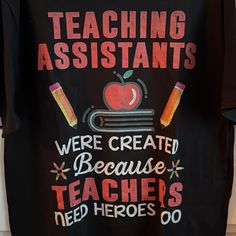 a t - shirt that says teaching assistants are created because teachers need heros