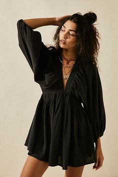 The definition of romantic, this mini from our free-est collection will turn heads with every wear. **Fit:** Relaxed, A-line silhouette **Features:** Plunge V-neckline, billowy banded sleeves, smocked waist, back keyhole button closure **Why We | For The Moment Mini Dress by free-est at Free People in Black, Size: XS Dirndl Outfit, V Neck Tunic, Bandeau Tops, Nashville Outfits, Flowy Mini Dress, Beach Skirt, Mini Robes, Party Dress Short, Puff Sleeve Dresses