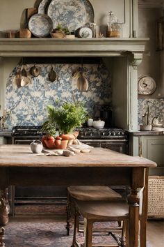 20 French Country Kitchen Ideas for Enchanting Spaces | Montana Happy Dining In The Kitchen, European French Kitchen, Alice Lane Interiors Kitchen, Cozy French Country Kitchen, Painted Island With Dark Wood Cabinets, British Style Kitchen, French Country Kitchen Island Ideas, French Country Estate Interior, Vintage Classic Kitchen