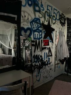 a bedroom with graffiti all over the walls