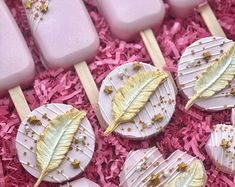 pink and gold leaf shaped lollipops on sticks