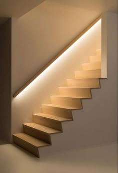 the stairs are made from wood and have lights on each side to illuminate them