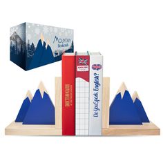 two books are sitting on top of each other in front of a mountain bookend