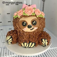 there is a cake that looks like a slotty bear with flowers on its head