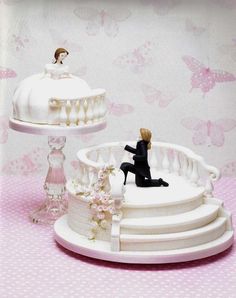 there is a cake on the table with a bride and groom figurine next to it