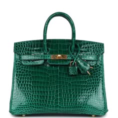 This Birkin is in Vert Emeraude shiny porosus crocodile with gold hardware and has tonal stitching, front flap, two straps with center toggle closure, clochette with lock and two keys, and double rolled handles.The interior is lined with Vert Emeraude chevre and has one zip pocket with an Hermes engraved zipper pull and an open pocket on the opposite side.Collection: COrigin: FranceCondition: Never worn (plastic on hardware)Accompanied by: Hermes box, Hermes dustbag, clochette, lock, two keys, clochette, clochette dustbag, felt, carebook, CITES, rainhatMeasurements: 10" width x 7.5" height x 4.75" depth; 2.75" handle drop Birkin Crocodile, Hermes Birkin 25, Hermes Box, Birkin 25, Madison Avenue, Hermes Birkin, Gold Hardware, Zip Pockets, Dust Bag