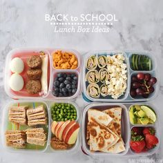 the lunch box is filled with different types of snacks and fruit, including crackers