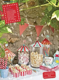 a table topped with lots of candy and popcorn