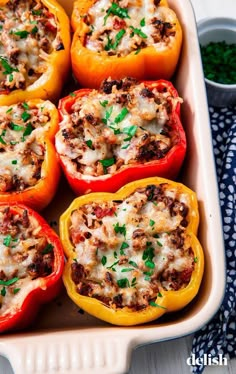 several stuffed peppers in a baking dish with the words classic stuffed peppers on top and bottom