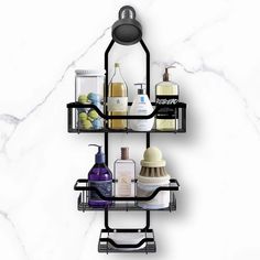 three tiered bathroom shelf with soap, shampoo and lotion