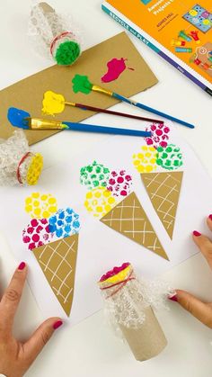 someone is making ice cream cones out of construction paper and crochet doily