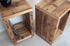 two wooden crates sitting next to each other