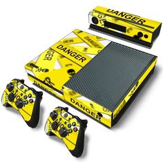 a yellow and black nintendo wii game system with two controllers, one for the controller