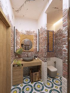 the bathroom is decorated in brick and has a colorful rug on the floor, along with a round mirror