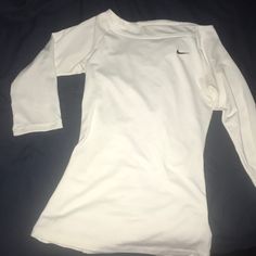 Super Cute Workout Shirt! Never Worn! Fits True To Size! It Is From The Tennis Line Of Nike. Basic White Nike Top, White Crew Neck Workout Tops, Basic White Workout Top, White Crew Neck Tops For Workout, Casual White Workout Shirt, Basic Nike Tops For Workout, Nike Fitted Long Sleeve Tops, Nike Crew Neck Fitted Top, Nike Fitted Crew Neck Top