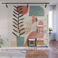 an abstract painting with leaves and shapes on the wall next to a chair in front of a bookshelf